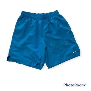Blue Nike shorts. Swim trunk material. Size M